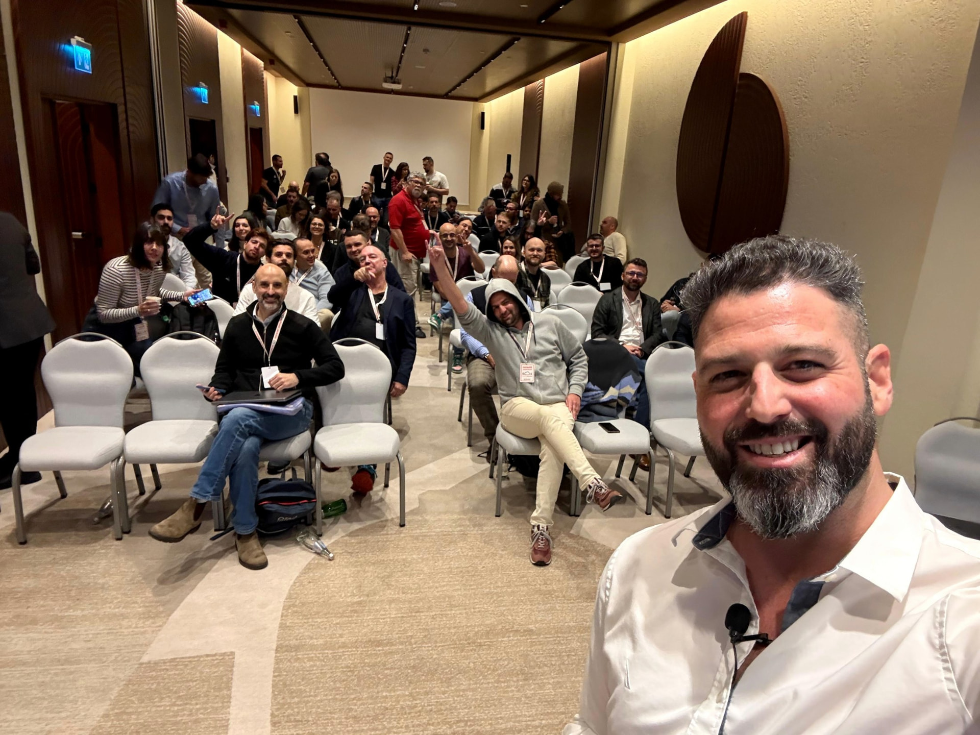 Liron Kaplan with a full room of attendees at a sales kickoff he ran