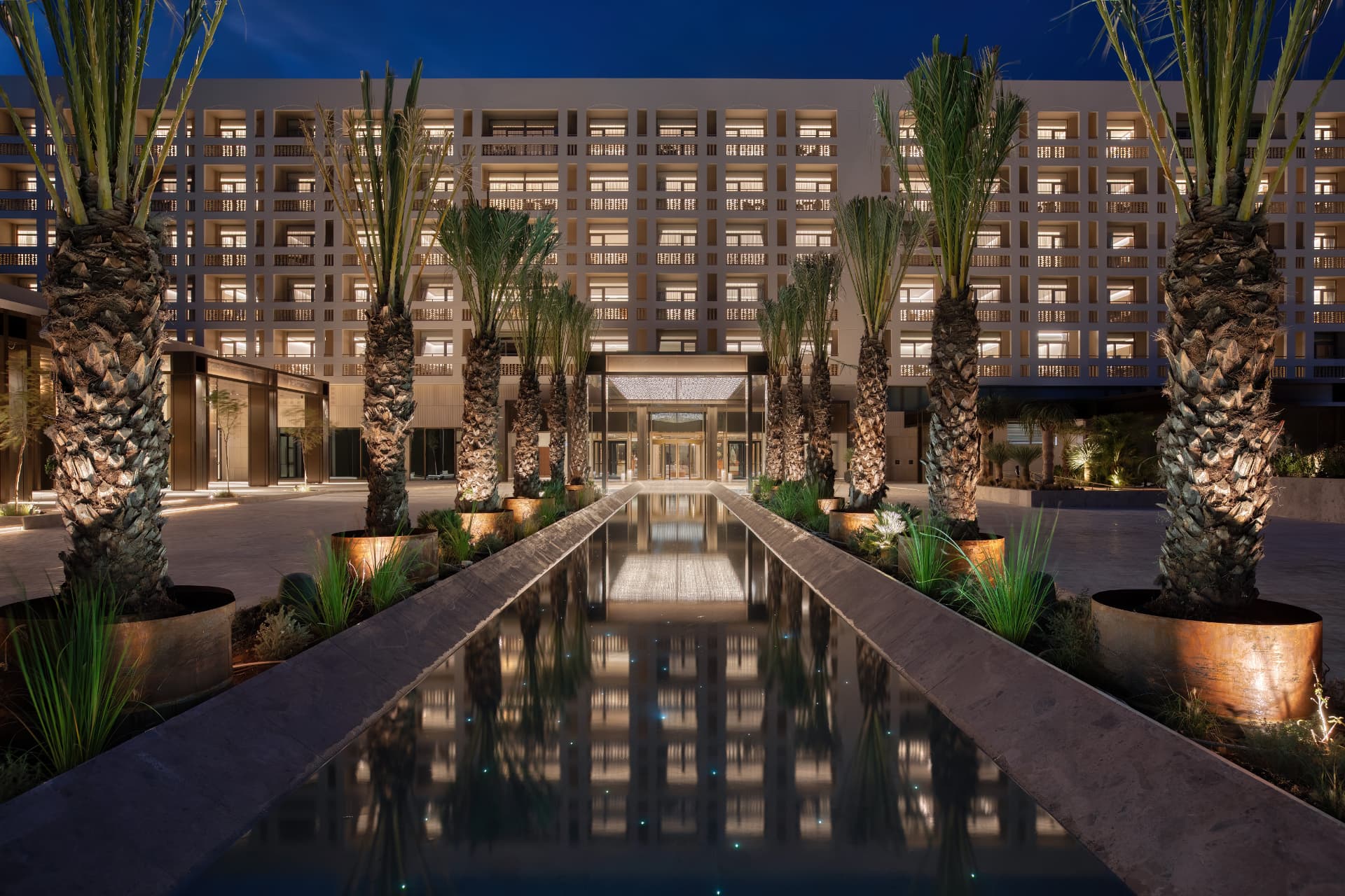 The Landmark Nicosia entrance and reflecting pool at twilight
